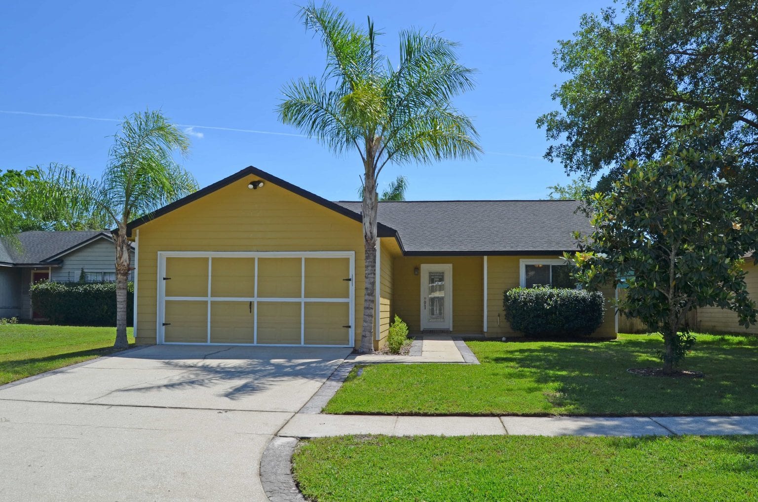 Front of rental home with nice lawn.